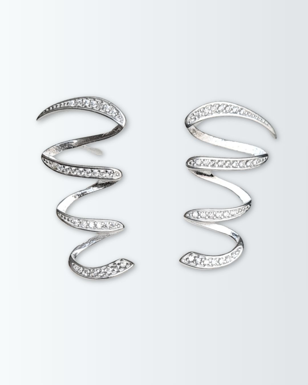 Aros de plata 925 con circonias en forma de espiral aplanado Aros de plata 925 con circonias en forma de espiral aplanado